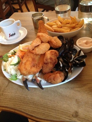 Great little place in Castletownbere, on the Beara Penisula. Huge fillet, six shrimp, thirty-six mussles, two monk fish and two big chunks of another fish ( sorry, I forget ), plus salad ( which is salad , cole slaw, and potato salad ) chips and drink. The boat was out back. Had just came in. About 14 Euros ( $18.00 ) I got it all down and a piece of pie.