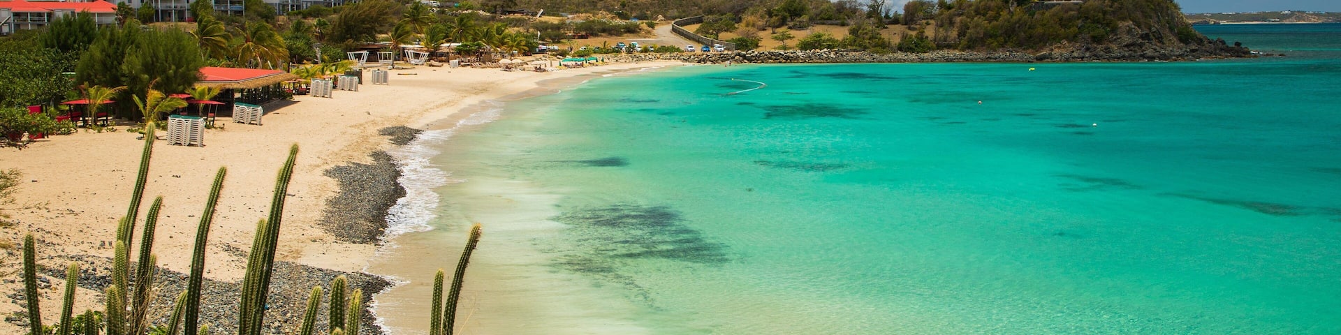 Friar\'s Bay showing a beach, general coastal views and a coastal town