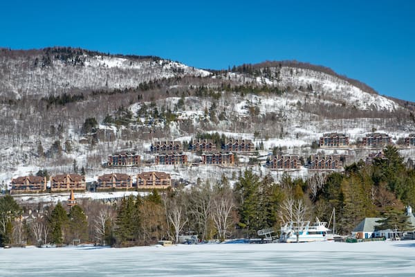 Lake Tremblant featuring snow, landscape views and a small town or village