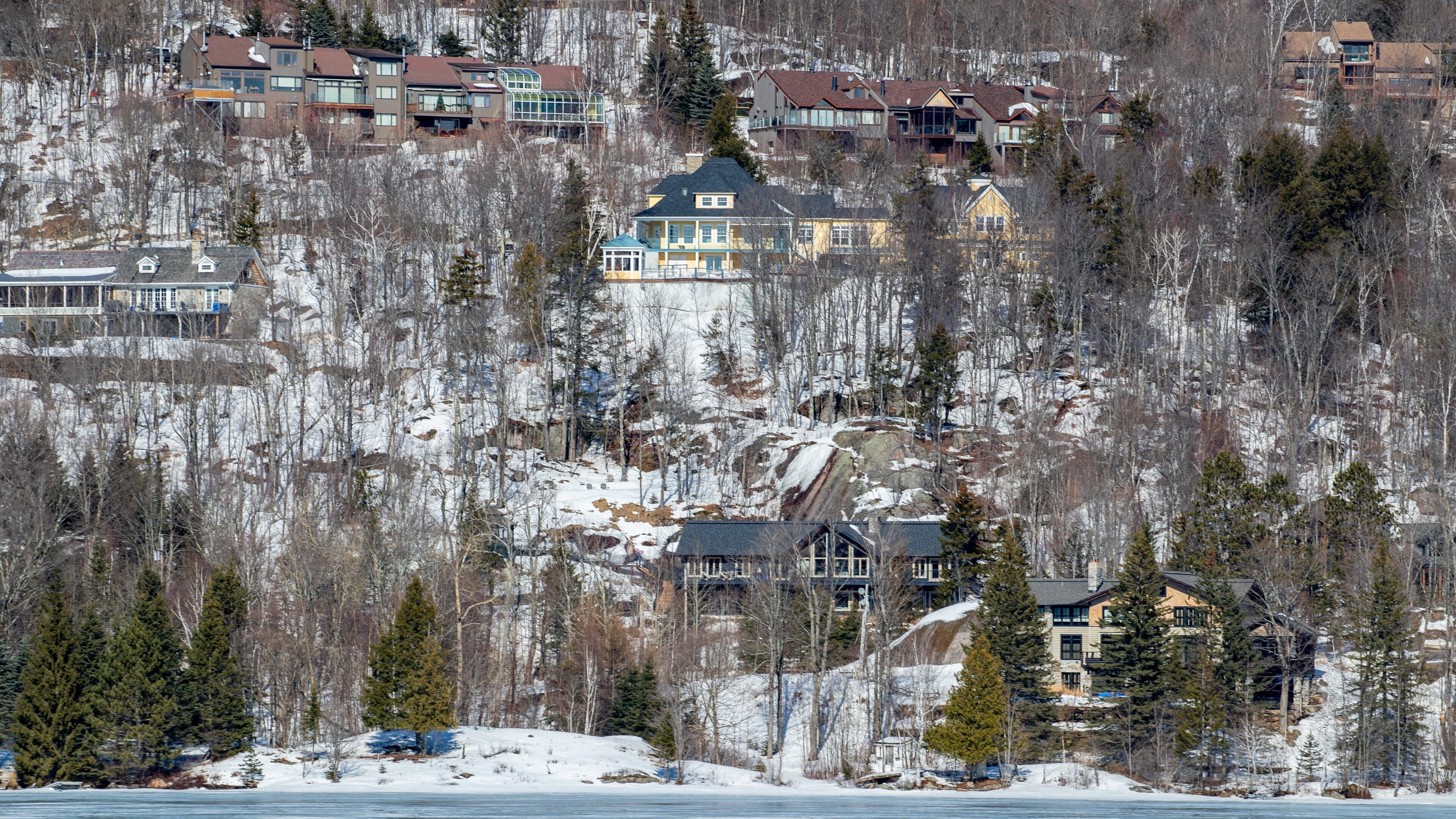 Lake Tremblant showing a small town or village and snow