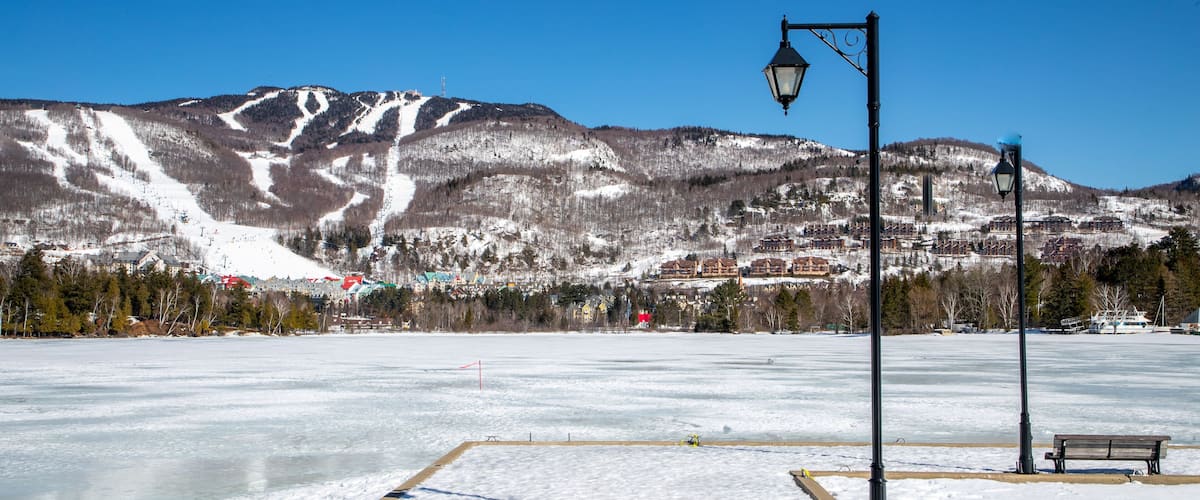 Lake Tremblant showing landscape views, snow and a lake or waterhole