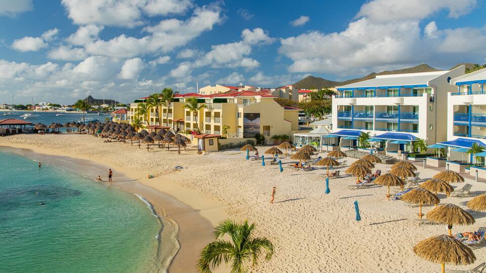 Pelican Key featuring a coastal town, general coastal views and a sandy beach