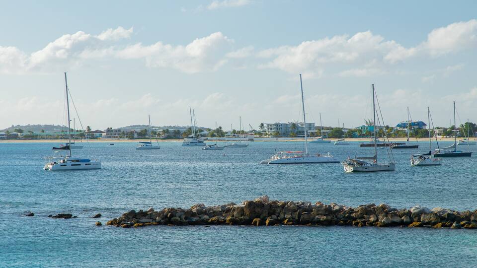 Simpson Bay showing a bay or harbor, a sunset and general coastal views