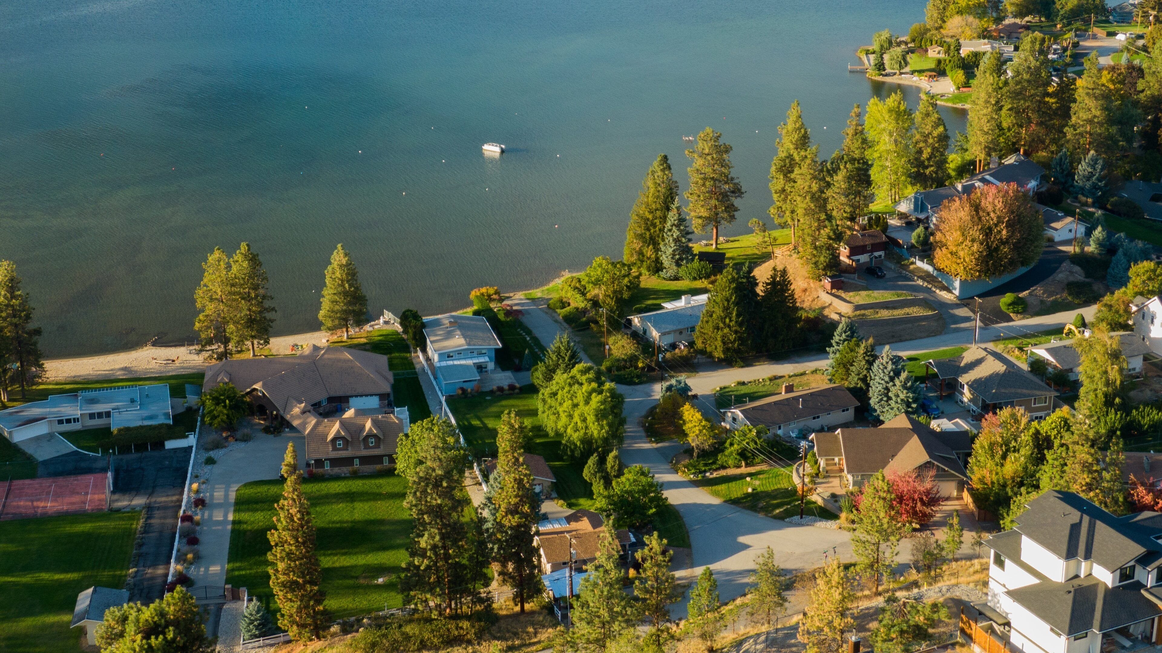 Skaha Lake featuring a small town or village and a lake or waterhole