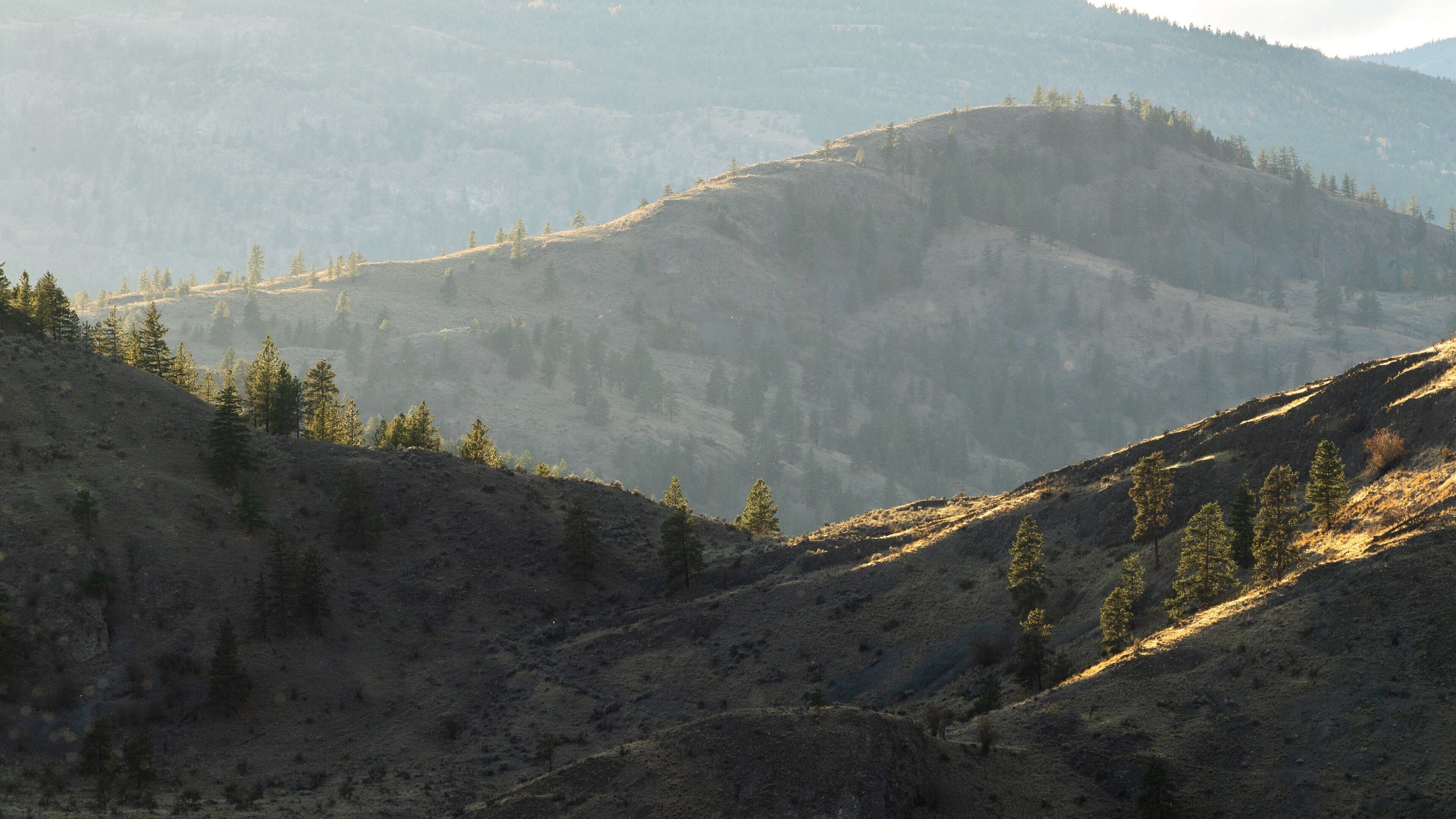 Skaha Lake which includes tranquil scenes, a sunset and mountains