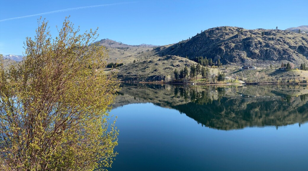 Wapato Lake in a sweeping panoramic view as seen from the Manson Scenic Loop drive with reflections on a beautiful early spring morning_20250405.4041.