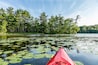 Kayak on Lake with lily pads