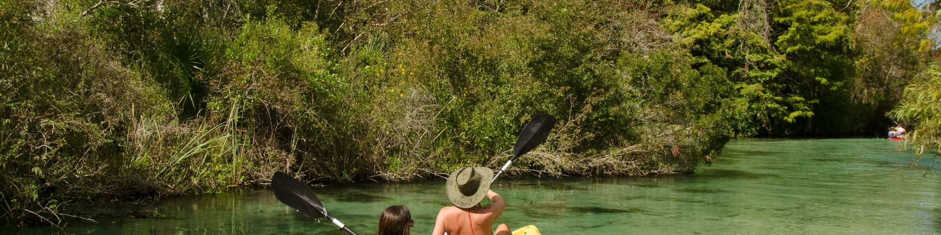 Woman kayaking on the Weeki Wachee River, Spring Hill Florida.