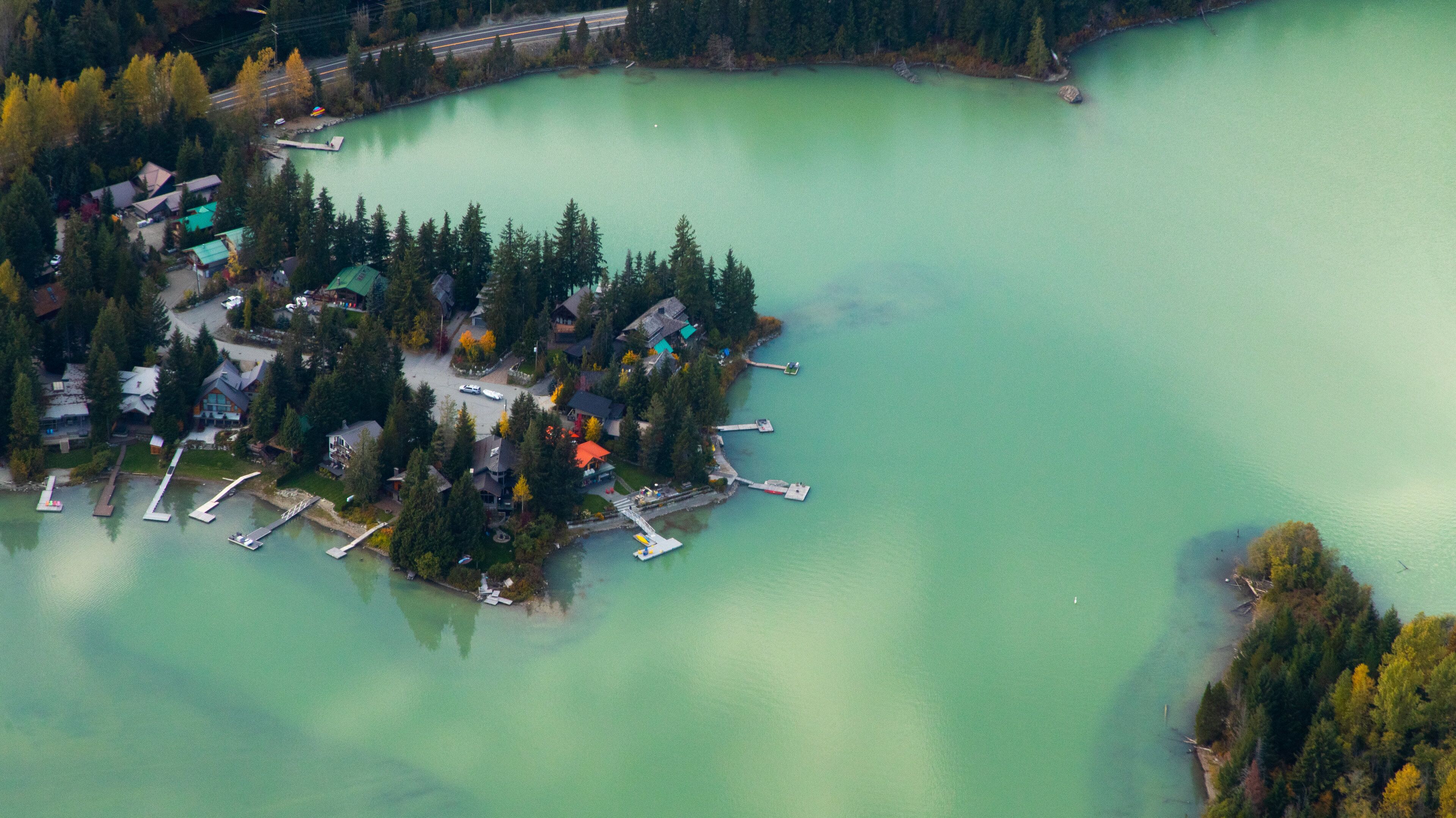 Green Lake showing a lake or waterhole and a small town or village