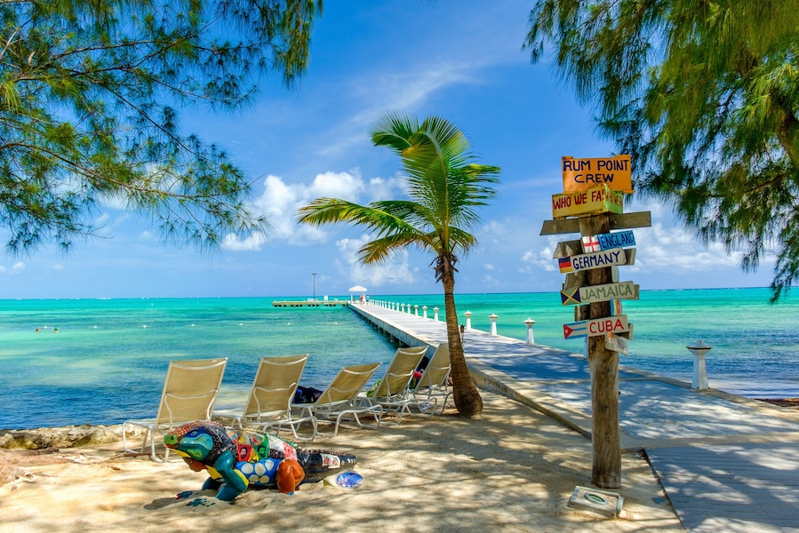 Grand Cayman, Cayman Islands, Rum Point Beach with view on the Caribbean Sea and a jetty