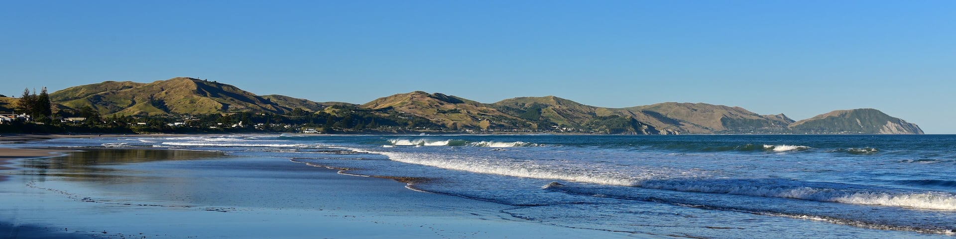 Wainui Beach with great view of nearby mountain ridges in Gisborne, Hawkes Bay, New Zealand, Shutterstock ID 1311858068, Purchase Order: SP-1822 ANZ-18120 Wotif Search Engine - Destination Imagery, Or