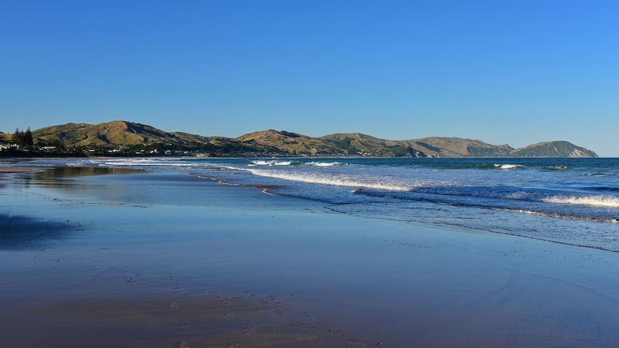 Wainui Beach with great view of nearby mountain ridges in Gisborne, Hawkes Bay, New Zealand, Shutterstock ID 1311858068, Purchase Order: SP-1822 ANZ-18120 Wotif Search Engine - Destination Imagery, Or