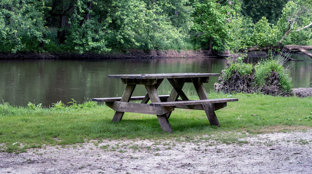 A picnic table sits ready for campers along the Tippecanoe river in a state park in Indiana USA