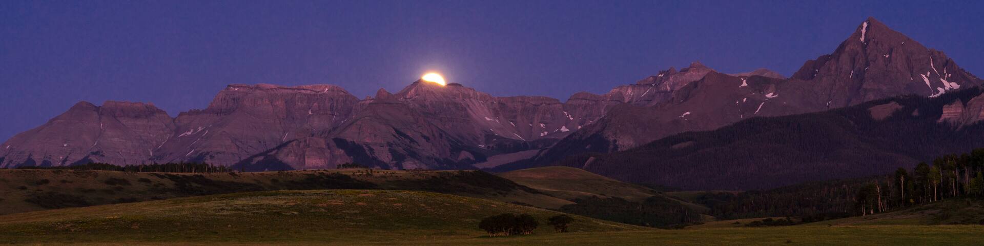 Full Moon rises over San Juan Mountains on Hastings Mesa, Colorado
