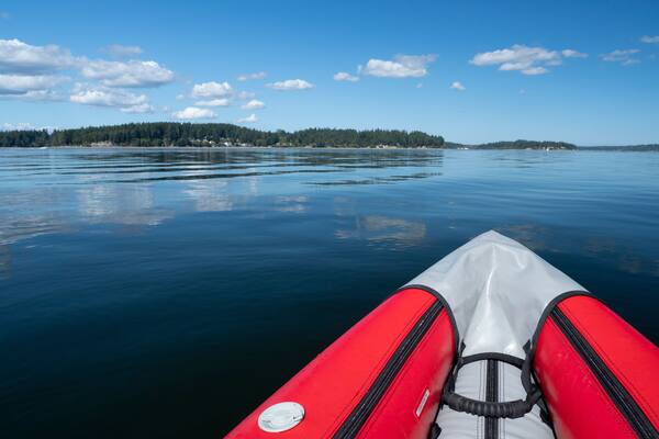 Usa, Washington State, Harstine Island, bow of inflatable kayak in water