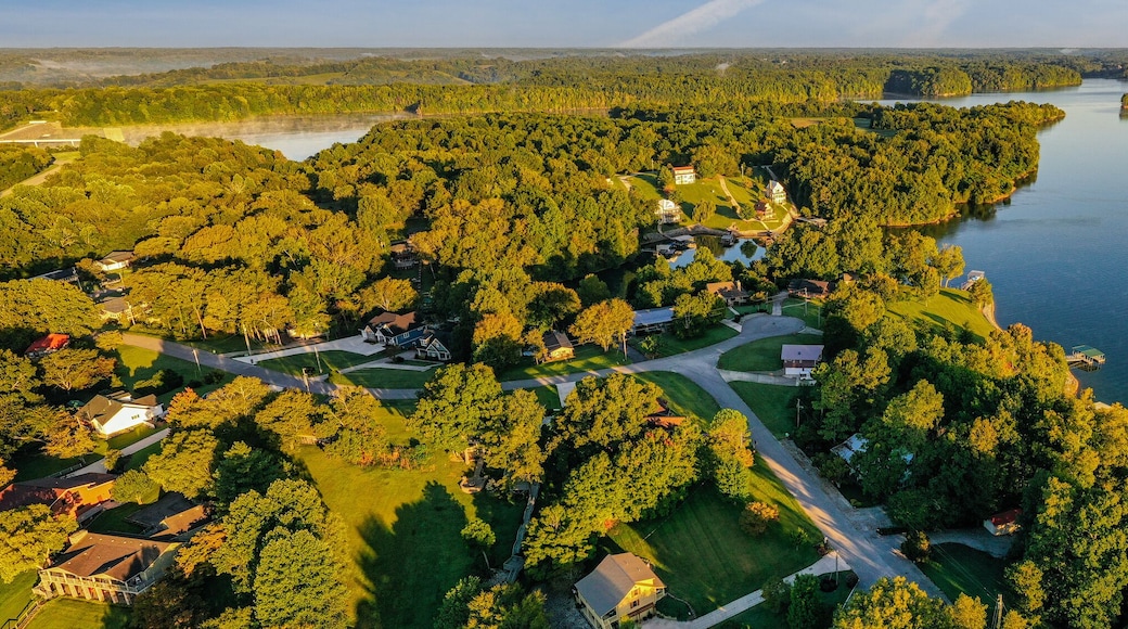 Aerial panorama view of lakefront and lake view homes, golf course and floating boat docks on Tims Ford Lake in Tennessee.