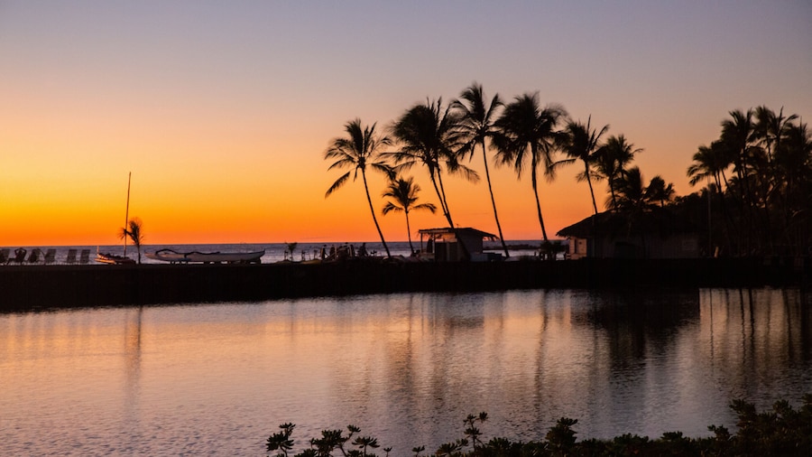 Waikōloa Beach which includes a sunset, general coastal views and tropical scenes