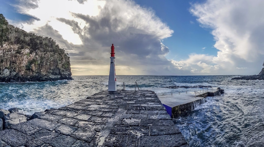 From the port of Caloura between heavy showers and sunshine. Not the day to take a swim.