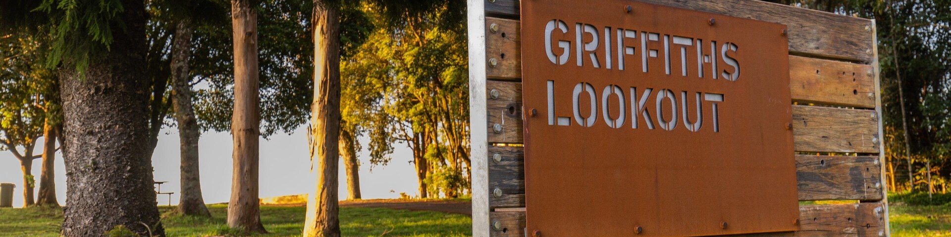 Griffiths Lookout featuring a garden and signage