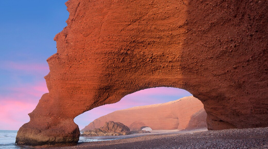 Famous Red arches at Legzira beach near Sidi Ifni on Atlantic coast in Morocco, Northern Africa. One of two rock archways has collapsed in 2016.