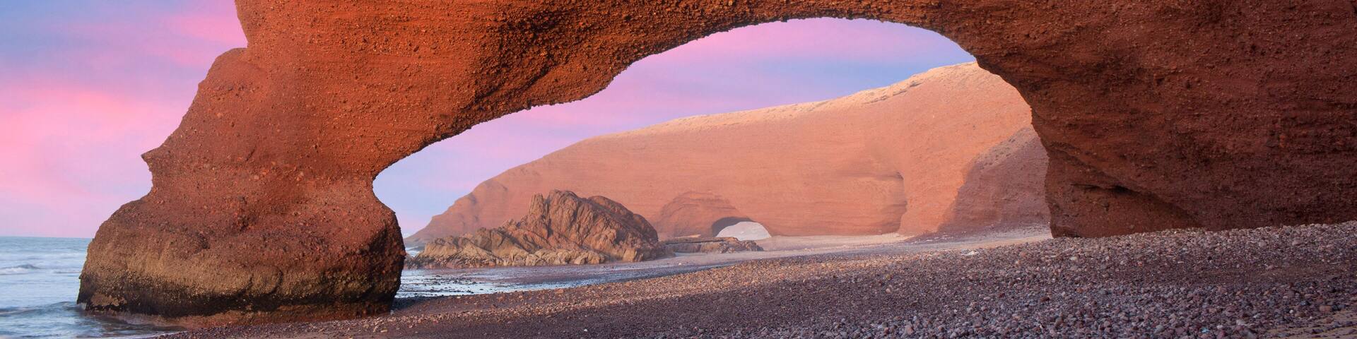 Famous Red arches at Legzira beach near Sidi Ifni on Atlantic coast in Morocco, Northern Africa. One of two rock archways has collapsed in 2016.