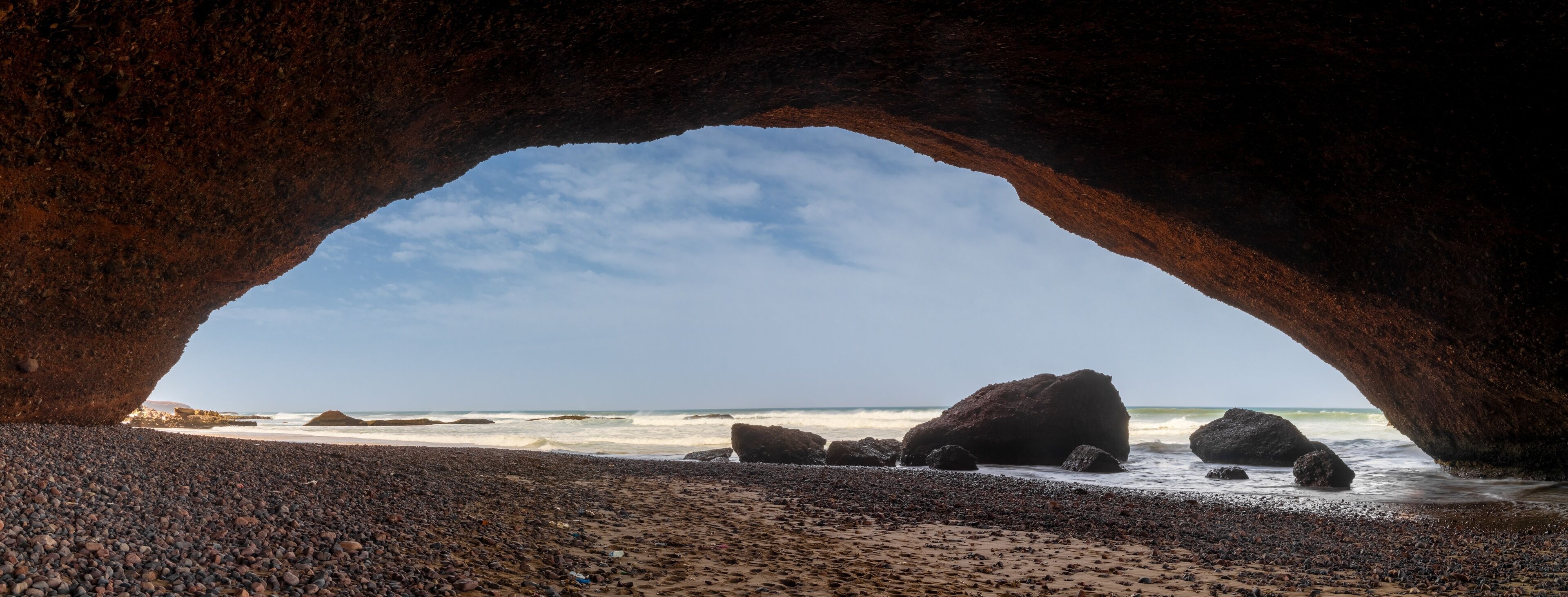 panorama landscape view of the beach and rock arch at Legzira on the Atlantic Coast of Morocco