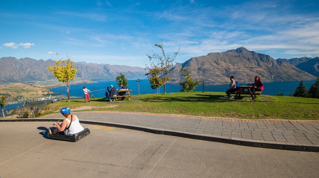 Skyline Luge featuring a park as well as an individual femail