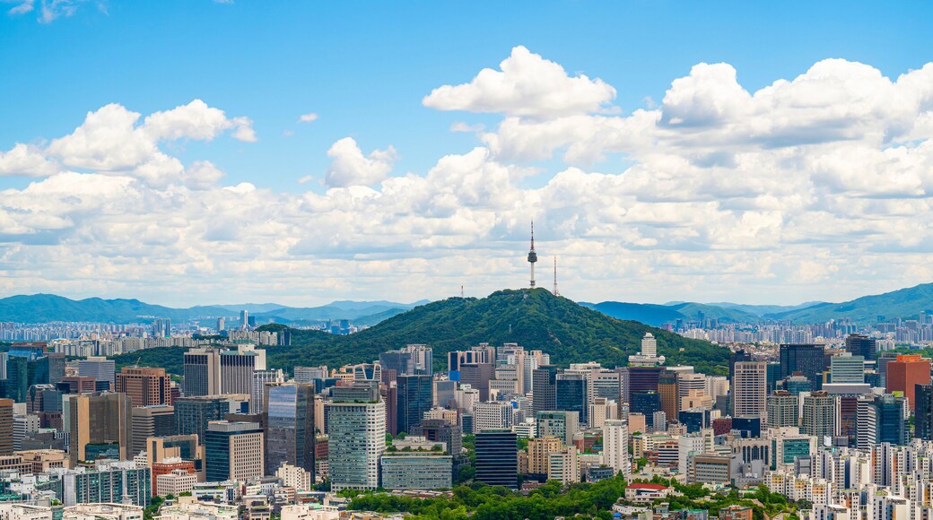 Beautiful cloudy day. The bright blue sky contrasts with floating white clouds,vibrant atmosphere of the city. Perfect for travel ads, urban lifestyle content.