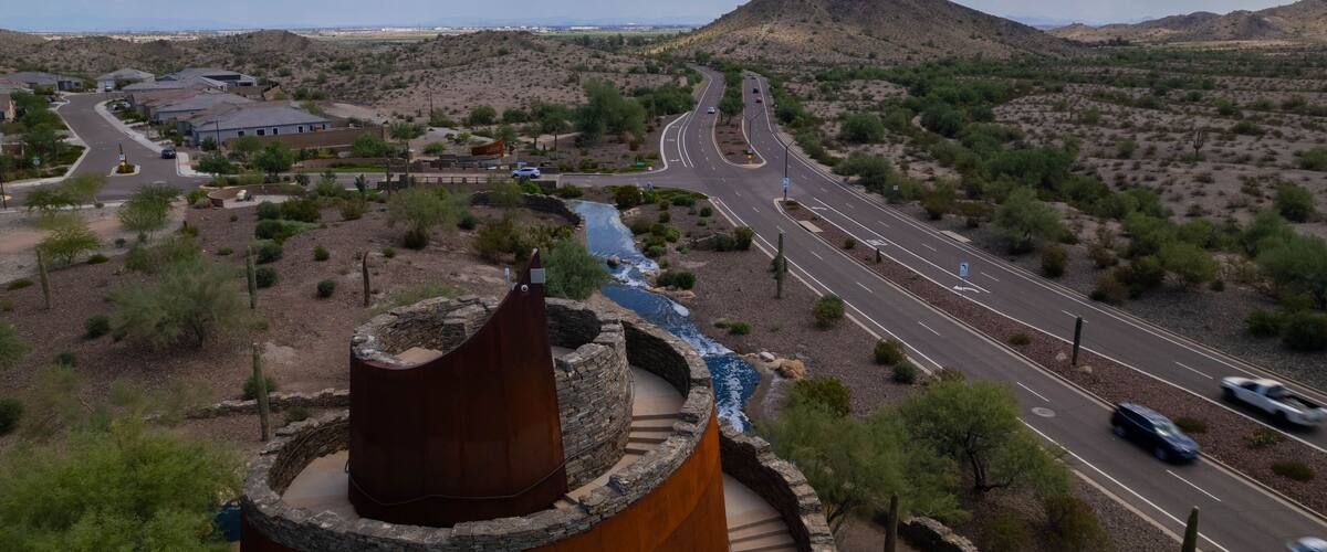 Aerial view of Estrella Star Tower by the highway in the countryside in Goodyear, Arizona