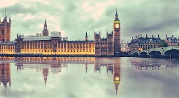 Panoramic view of Houses of Parliament, Big Ben and Westminster Bridge with reflection, London