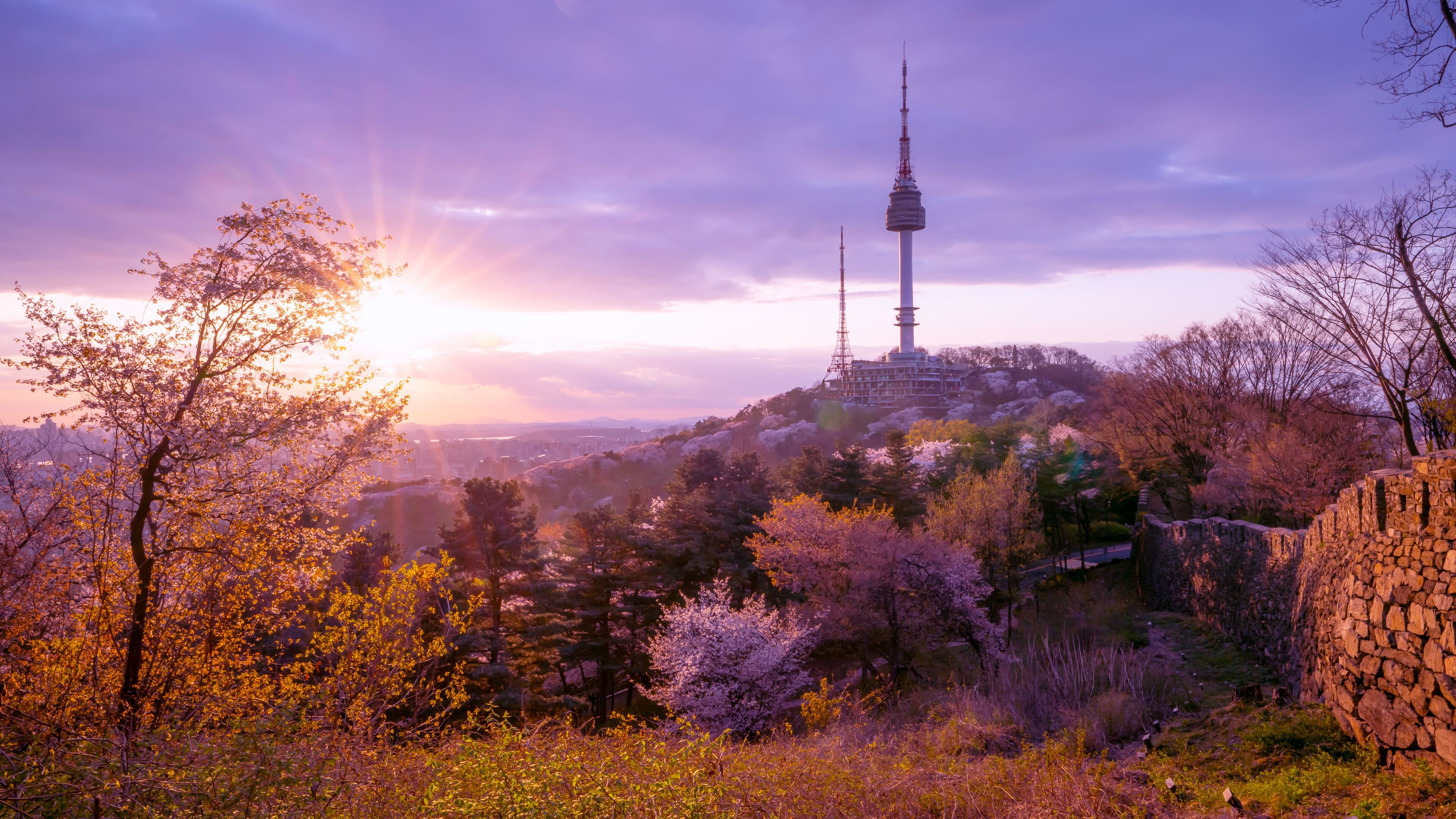 View of sunset in seoul city with seoul tower at namsan public park.