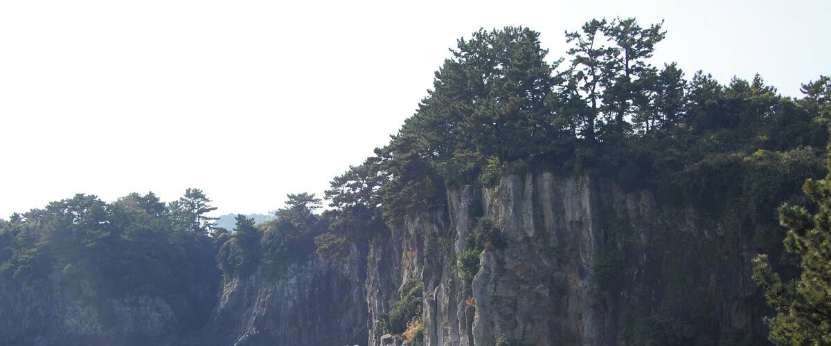 Near the Jeongbang Waterfall 정방폭포. The waterfall is 23 meters high and is very close to the ocean.