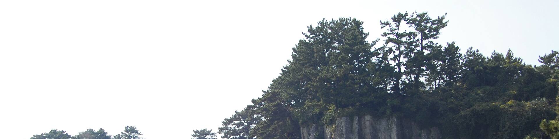 Near the Jeongbang Waterfall 정방폭포. The waterfall is 23 meters high and is very close to the ocean.