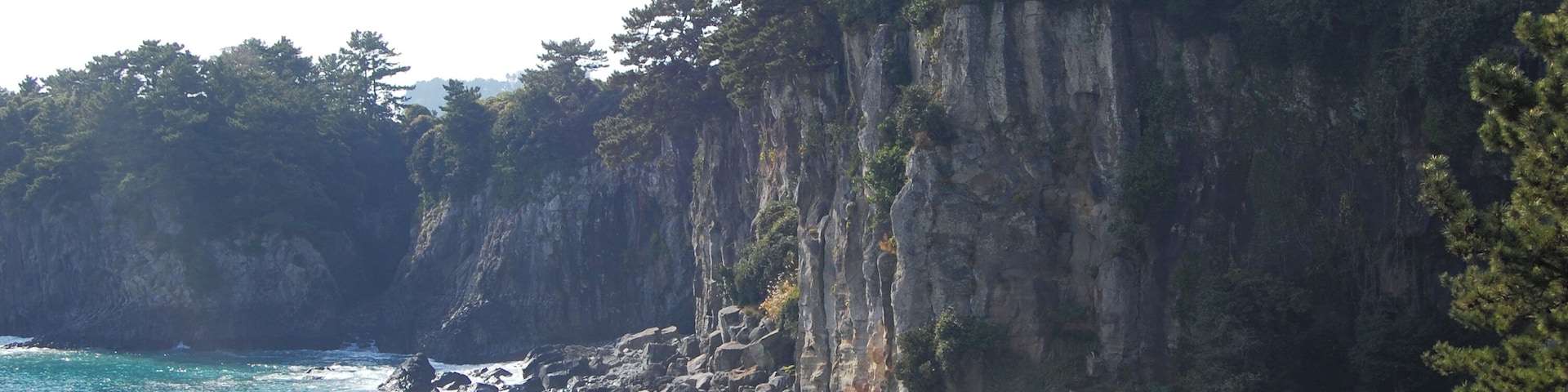 Near the Jeongbang Waterfall 정방폭포. The waterfall is 23 meters high and is very close to the ocean.