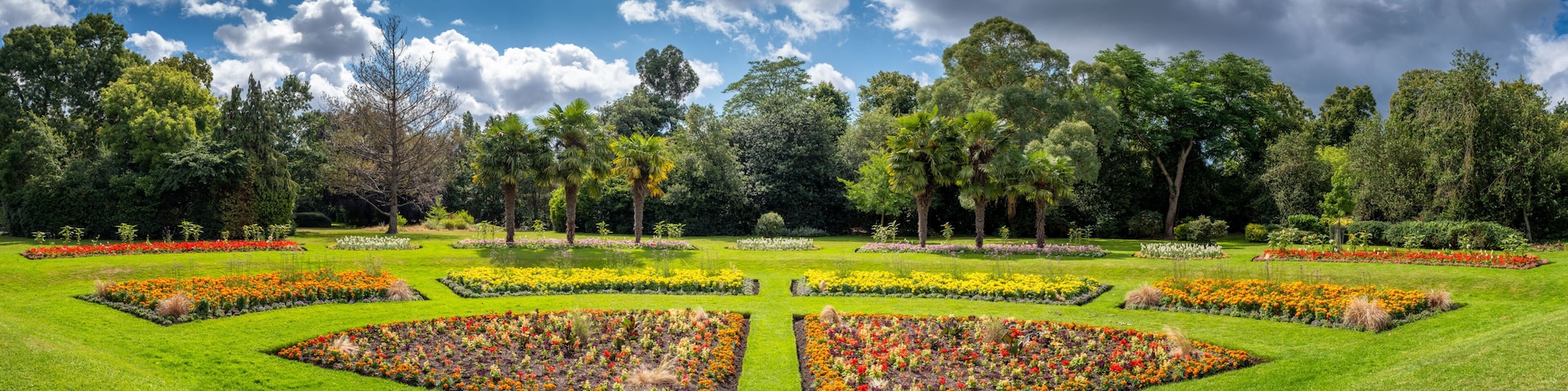 Panoramic view of summer flowers in full bloom in the sunken Garden in Victoria Park in Hackney, East London, England