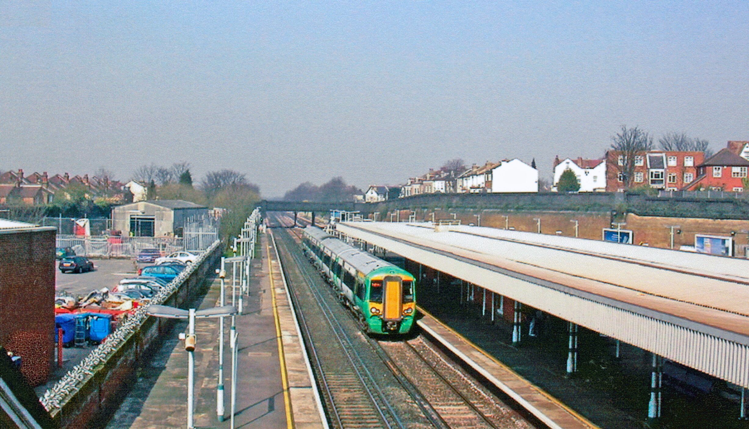 Thornton Heath station. View NW from the Brigstock Road bridge, towards Clapham Junction and Victoria: ex-LB&SCR Victoria - Brighton etc. main line. A Down express is passing on the Fast lines.