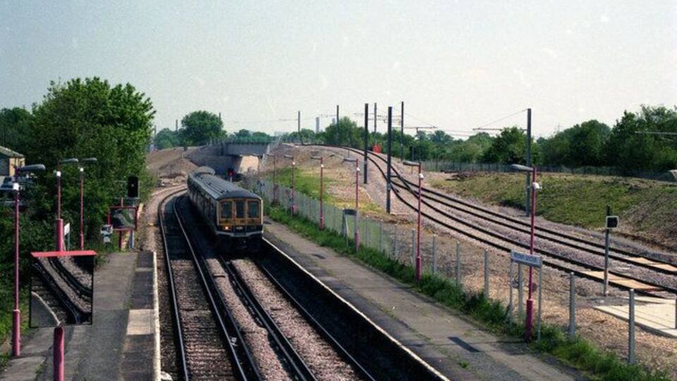 Mitcham junction station A Class 319 'Thameslink' train is approaching the station from the Sutton direction. It will continue to London and Luton via Streatham.