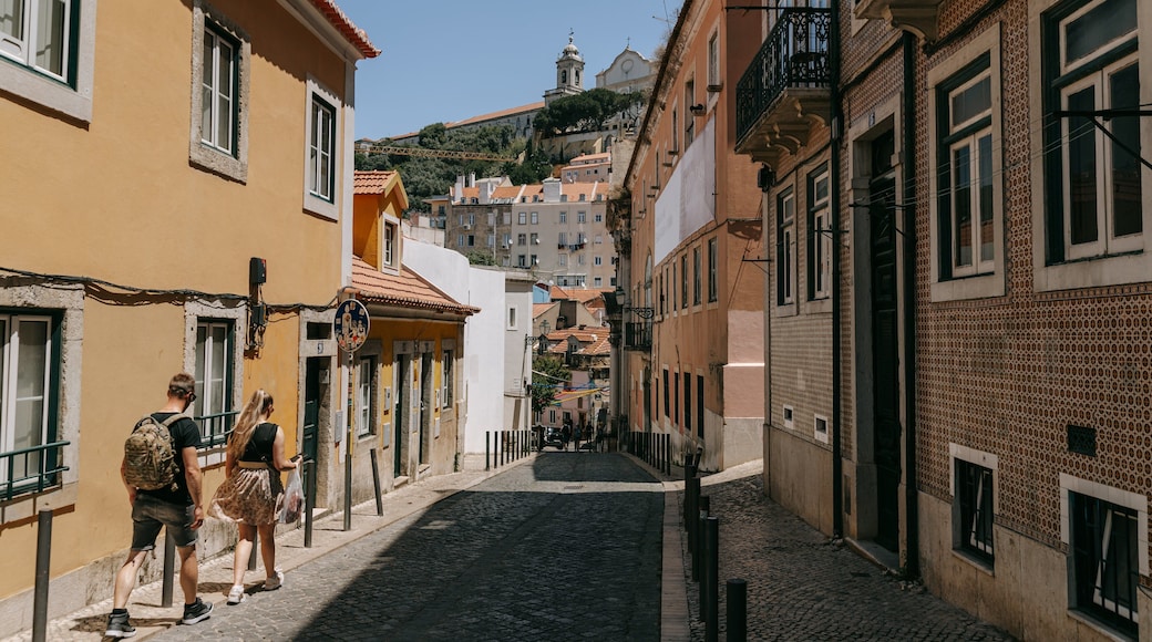 Mouraria featuring street scenes as well as a couple