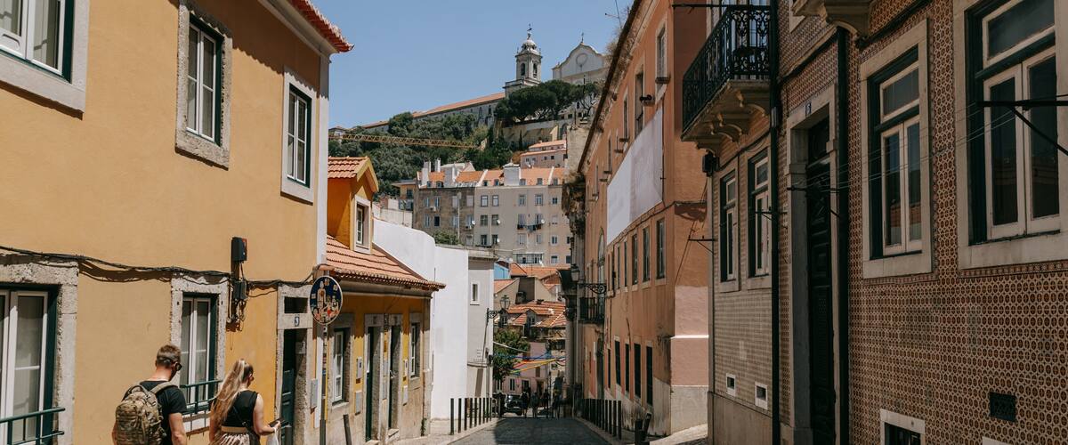 Mouraria featuring street scenes as well as a couple