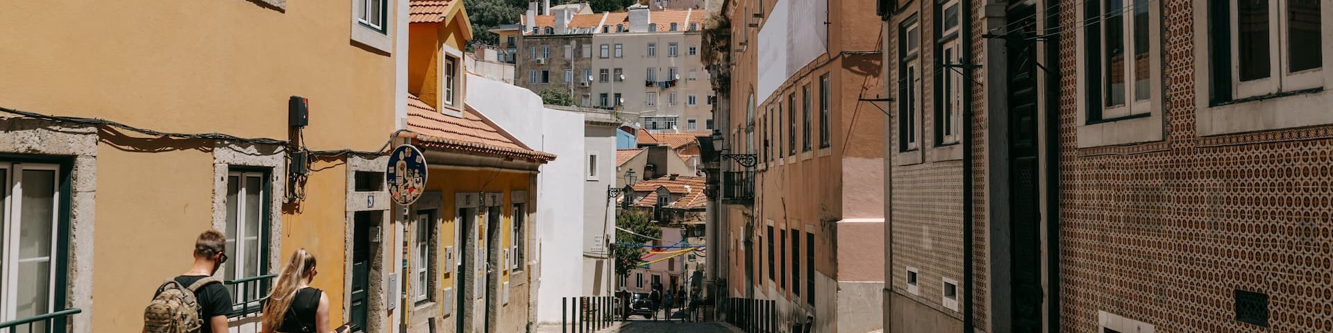 Mouraria featuring street scenes as well as a couple