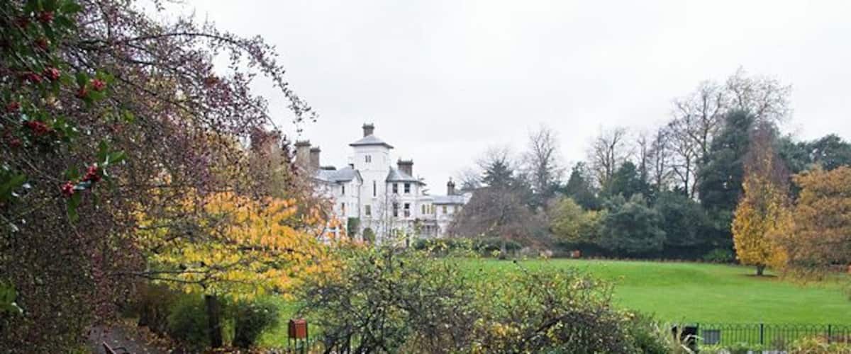 Autumn Avenue House The house, seen from just behind the lake in the park. Some nice autumn colours on the deciduous trees and red berries aplenty on the Holly. The house and grounds were left to the people of Finchley by Henry Charles Stephens in 1918. See http://www.avenuehouse.org.uk/ for more information.