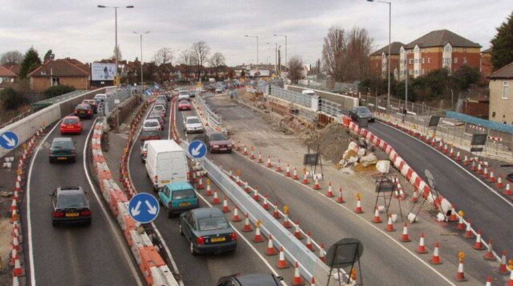 Traffic on temporary bridge during replacement. Two railway bridges on the dual carriageway A40 in Acton are being replaced - see 313384 for earlier photo and more information. This is Perryn Road bridge, across the London Overground railway. At present there are temporary bridges each for one lane of traffic either side of the original bridge, and pedestrian/cycle bridges hanging outside. The original westbound carriageways have one lane each way at present, the original eastbound carriageways are not in use while the bridge below them is replaced. Lots of traffic cones, and rather confusing for traffic, there is a speed limit. Photo from footbridge.