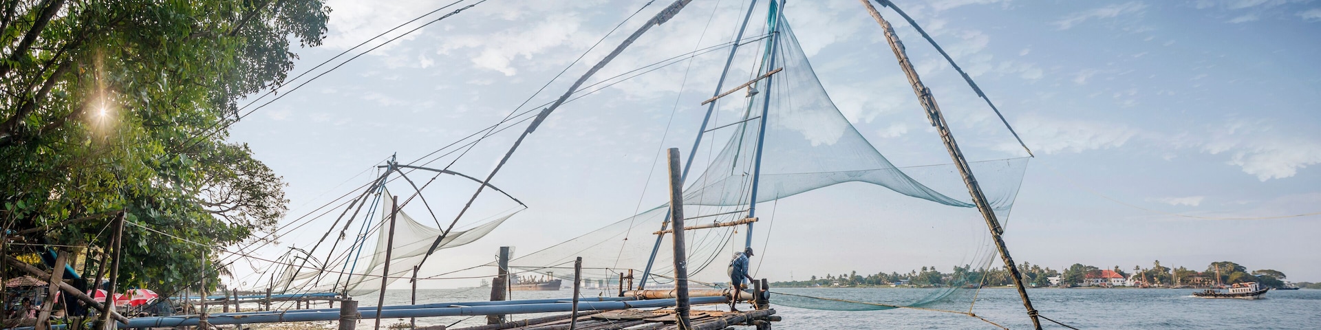 KOCHI, INDIA - OCTOBER 1 , 2018: Ocean coast landscape with chinese fishing nets silhouette at Cochin (Kochi). South India, Kerala, Kochin