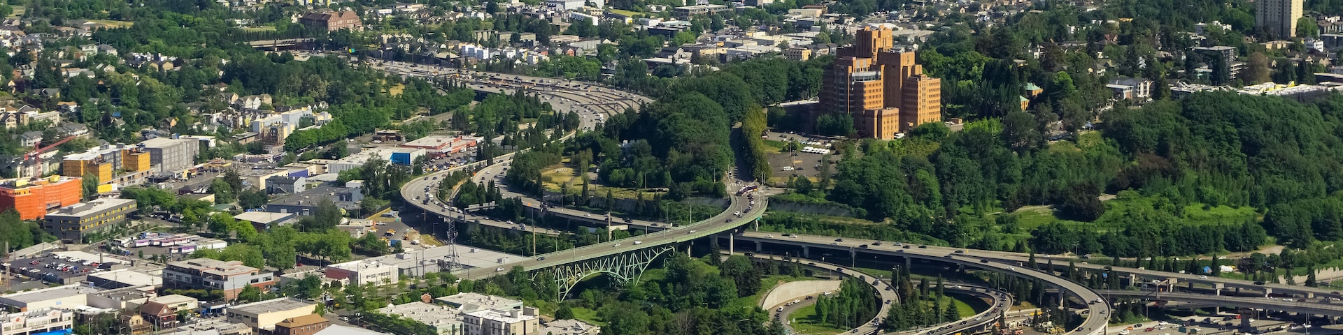 Aerial view of the Interstate 5 expressway in Seattle, the International District, Atlantic, North Beacon Hill, Mt Baker and Lake Washington, USA.