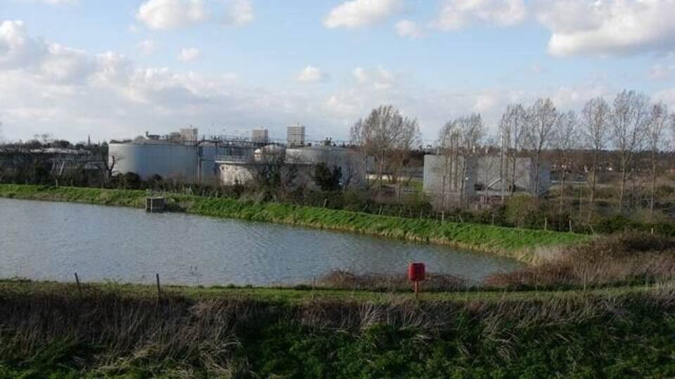 Hogsmill sewage works The buildings house mechanical sludge driers (compressors) which replaced sludge drying lagoons in the late 90's. The pool in the foreground was left in mitigation for the loss of the wildlife value that the sludge lagoons had.