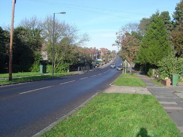 Pinner: Rayners Lane. Viewed looking northwards, Yeading Brook flows under the road at the bottom of the hill.