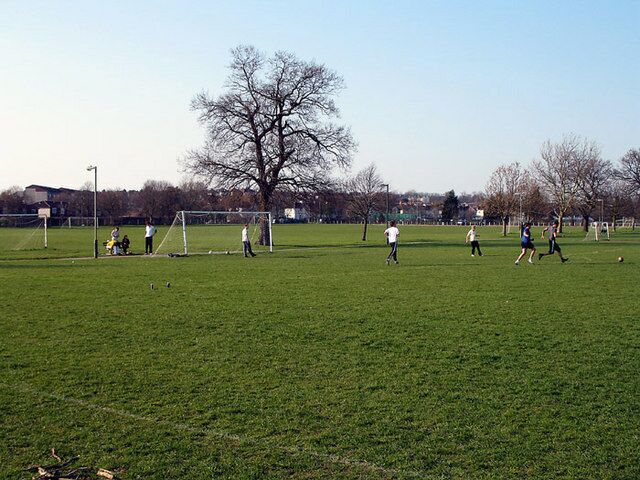Football Practice A group of lads practice their football skill on a sunday afternoon on Barnet Playing Fields.