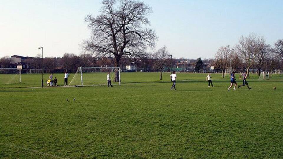Football Practice A group of lads practice their football skill on a sunday afternoon on Barnet Playing Fields.