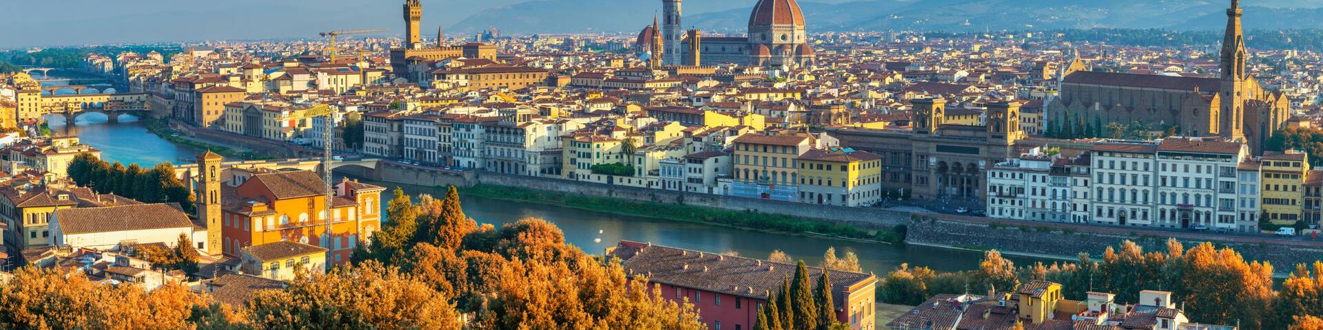 Florence Italy, panorama city skyline at Arno river with autumn foliage season