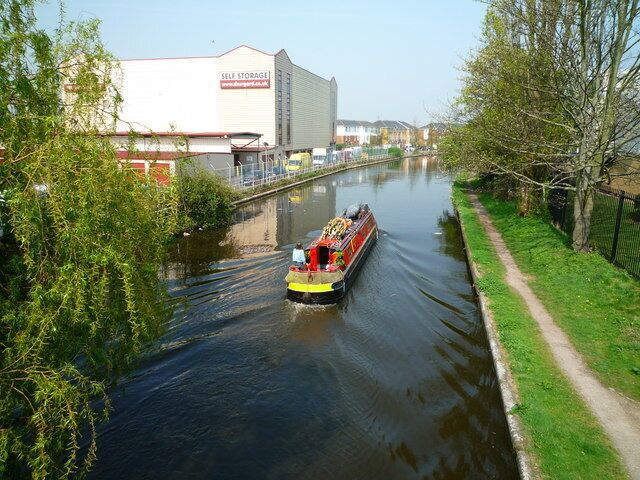 Narrow boat on the Grand Union Canal The narrow boat has just passed under the bridge next to the Hambrough Tavern.